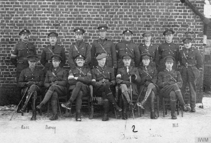 War poet, Lieutenant Edmund Blunden of the Royal Sussex Regiment (extreme right, second row) and a group of his fellow officers. (IWM Q 71249)